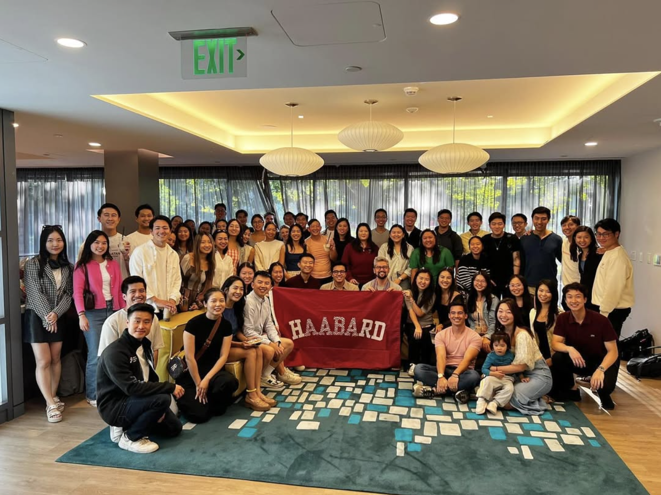 AABA members group photo with a Harvard banner